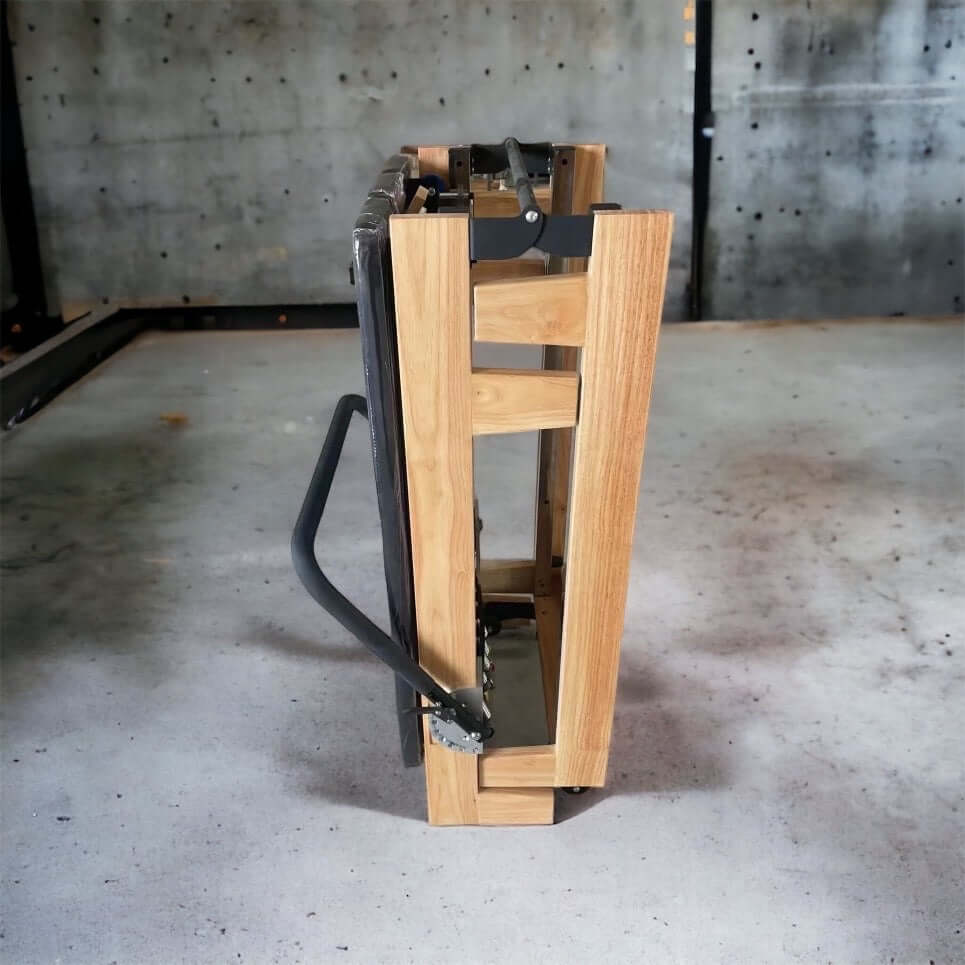 Compact Pilates reformer stored under bed