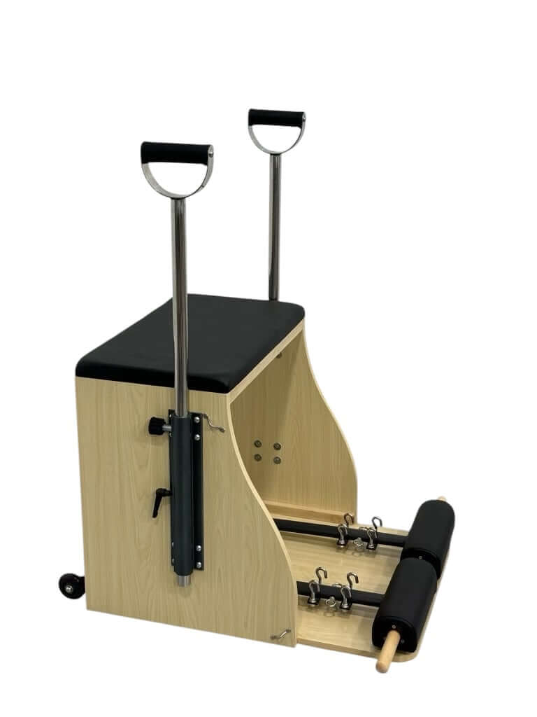 Studio-grade Pilates Wunda Chair with adjustable resistance and padded seat for core and strength training.