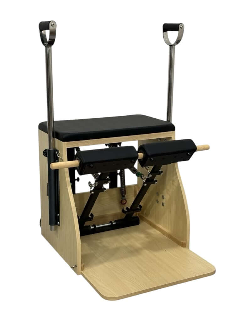 Compact Wunda Chair in a modern home Pilates studio, perfect for small space training and resistance-based movement.