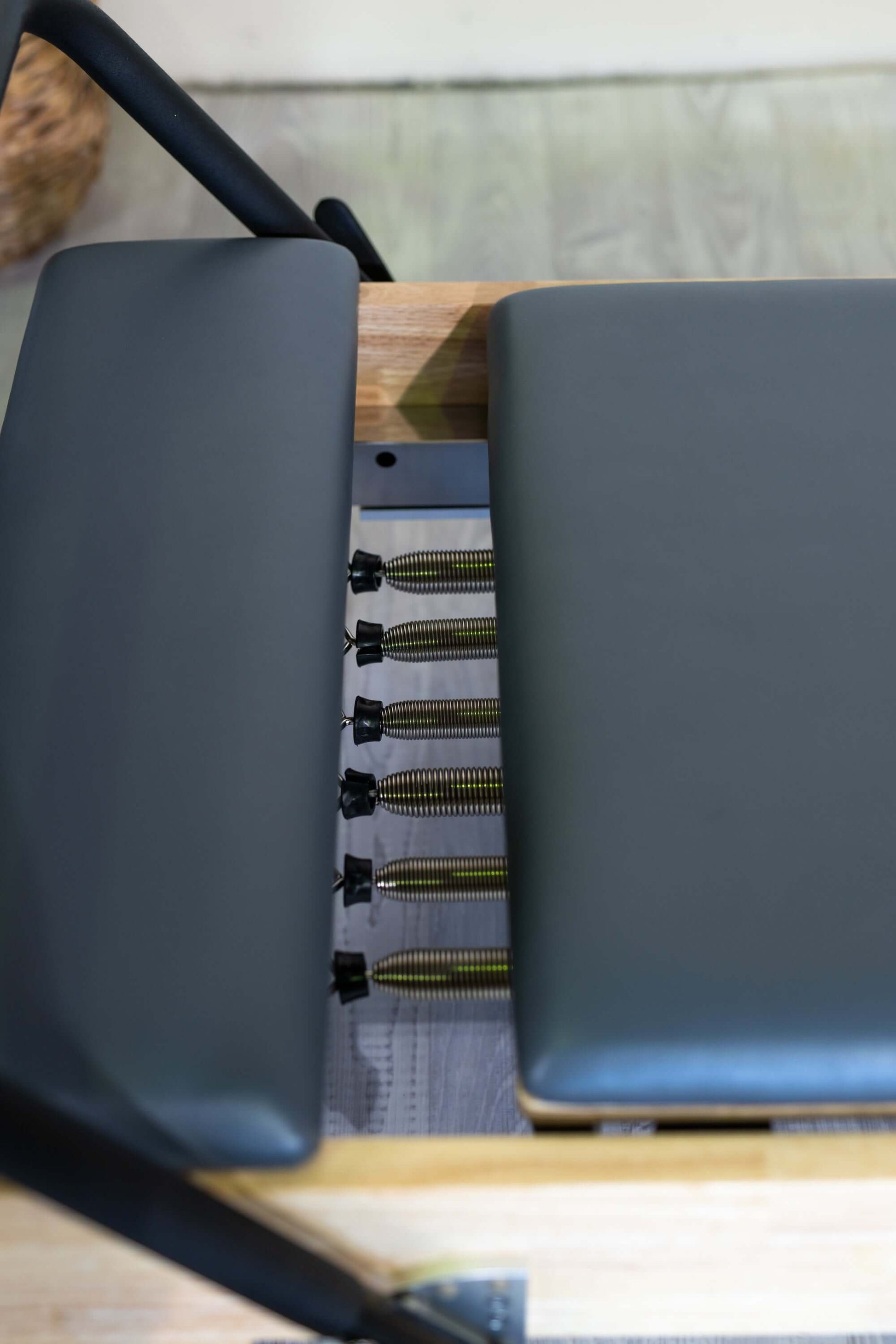 FSC-certified wooden frame on folding Pilates reformer
