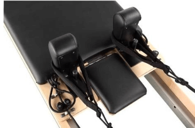 Studio-grade Eco Pilates Reformer machine shown with jumpboard, box, and platforms