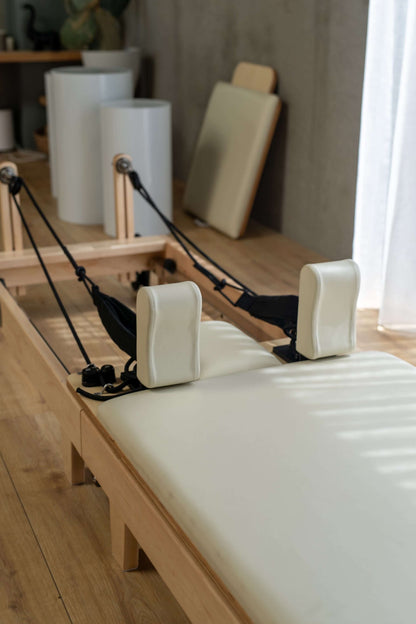 Portable Pilates reformer in small home workout space