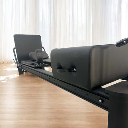 Close-up of Queen Reformer’s padded carriage and gliding track
